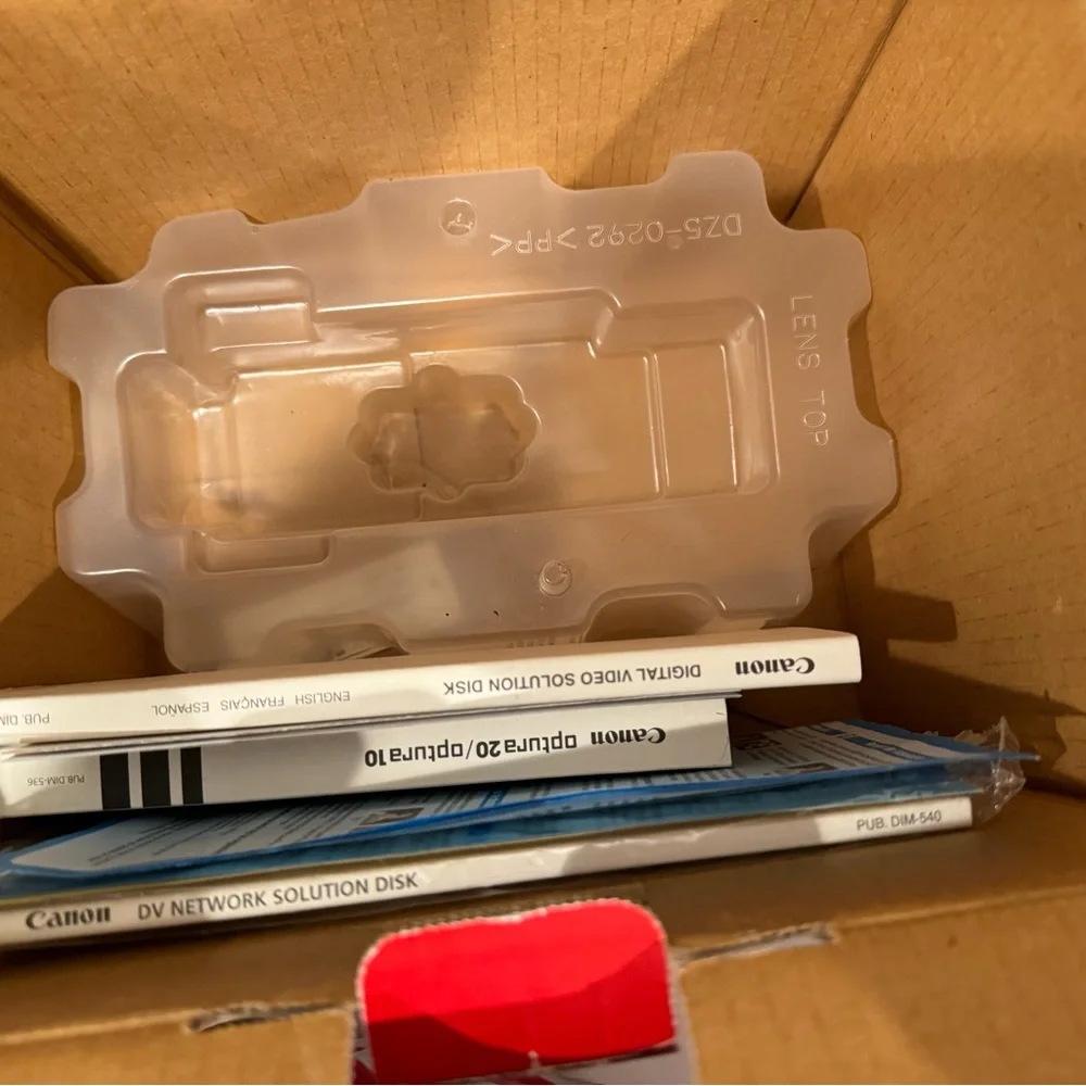 Canon Silver Compact Camcorder with Lens Cap and Cables